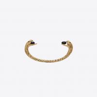 saint laurent snake bracelet in gold metal with black glass beads.