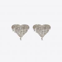 saint laurent smoking shooting heart earrings in brass and white crystals