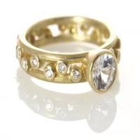 large double pebble ring in gold with diamonds & center stone
