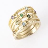 tapered forged band in gold with center diamond