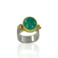 oval emerald cabochon ring with diamond trefoils