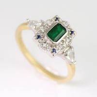 limited collection two tone ribbon frame ring in 18k yellow gold and platinum with emerald and pear rose cut diamonds