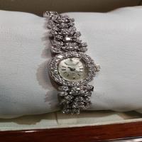 ladies 14kt white gold & diamond bulova watch (store special)