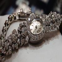 ladies 14kt white gold & diamond bulova watch (store special)