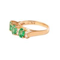 three emerald ring with diamonds