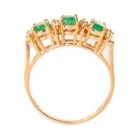 three emerald ring with diamonds
