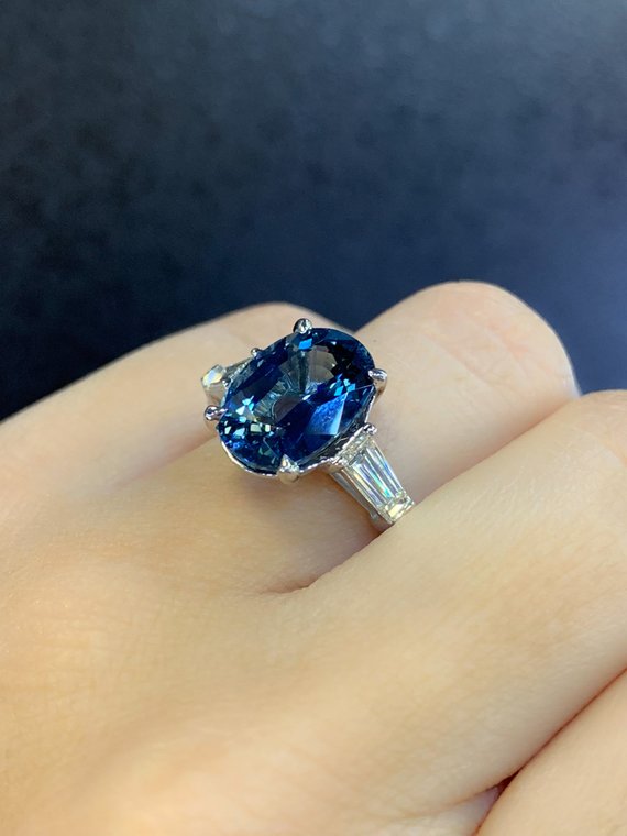 Sapphire ring with baguette on sale diamonds